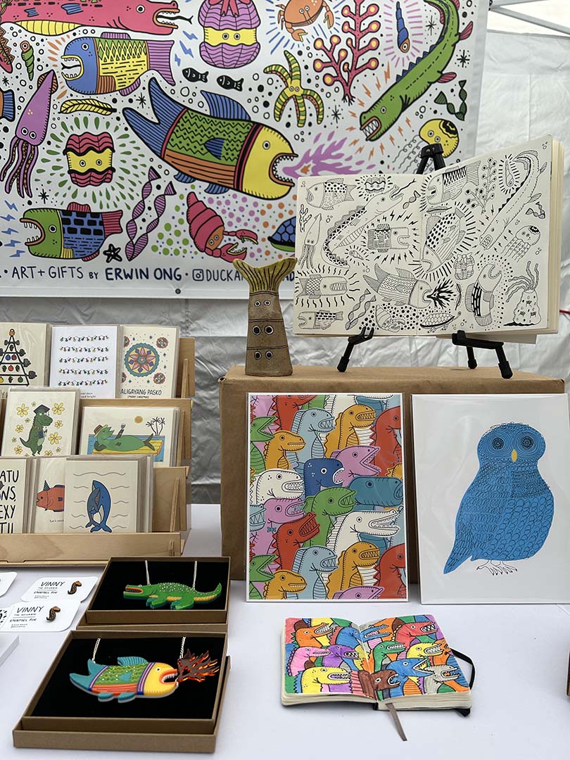 A Duck Amuck Art Studio & Gift Shop's display table at a craft fair